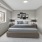 a bedroom with a large window