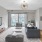 a living room with a large window and a couch