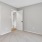 a room with grey walls and a closet